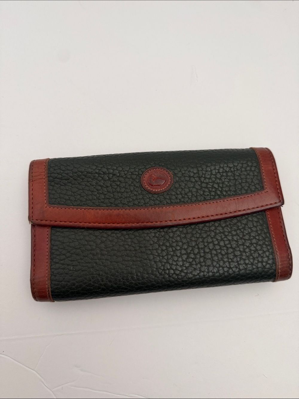 Dooney & Bourke Black Pebbled Leather Wallet with Brown Trim